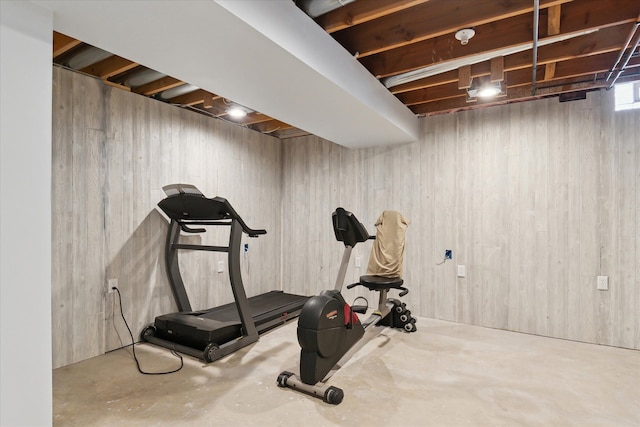 workout area with wooden walls