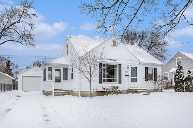 view of front of home featuring a garage and an outdoor structure