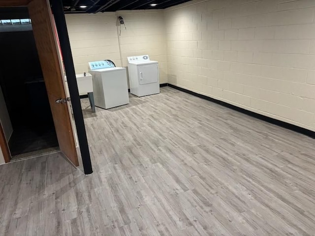 washroom featuring independent washer and dryer and light wood-type flooring