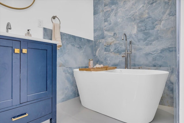 bathroom featuring tile walls and a tub to relax in