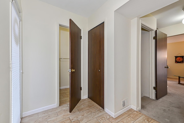 corridor featuring light hardwood / wood-style flooring