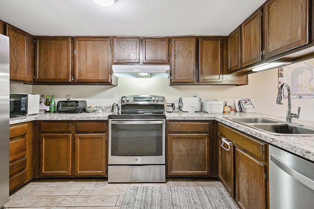 kitchen with appliances with stainless steel finishes and sink