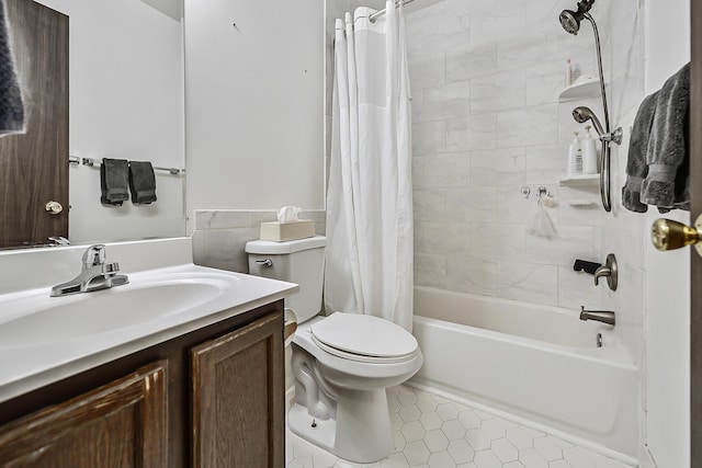 full bathroom with toilet, vanity, tile patterned floors, and shower / bath combo with shower curtain