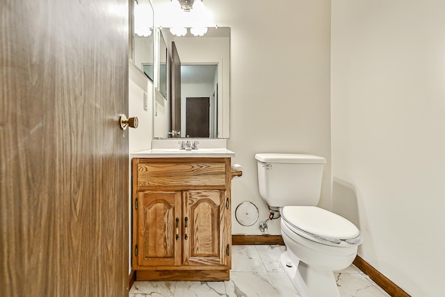 bathroom featuring toilet and vanity