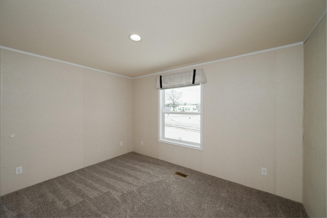 empty room with carpet floors and ornamental molding