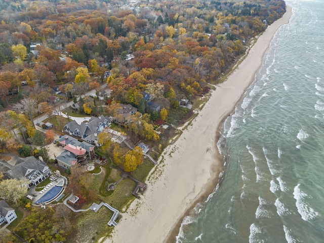 birds eye view of property featuring a water view and a view of the beach