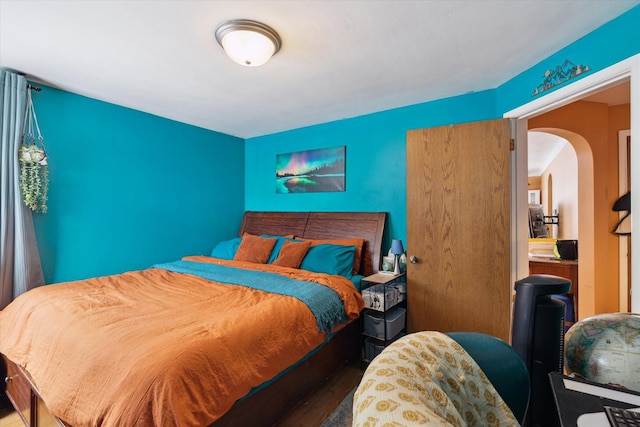 bedroom with wood-type flooring