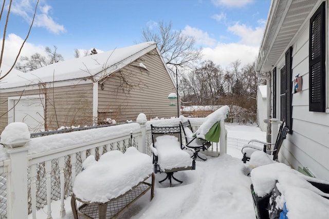 view of snow covered deck