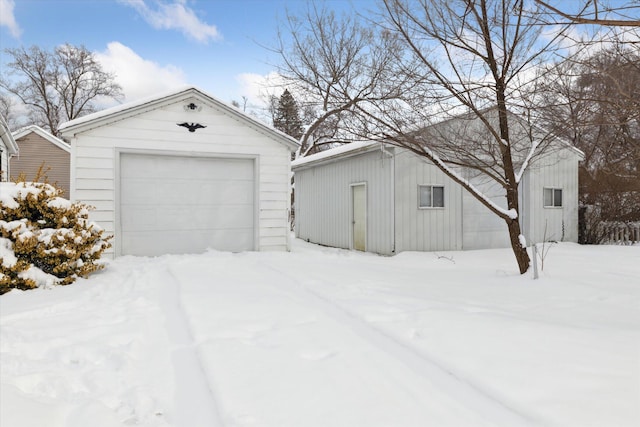 view of snow covered garage