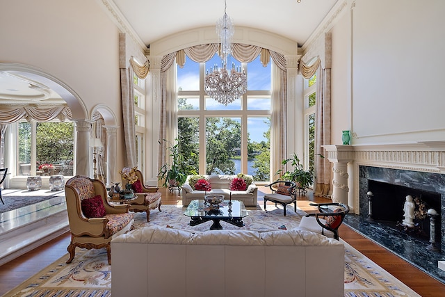 living room featuring hardwood / wood-style flooring, plenty of natural light, and a fireplace