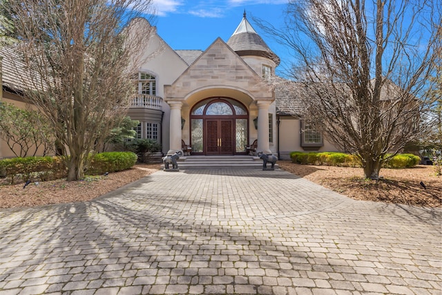 entrance to property featuring french doors