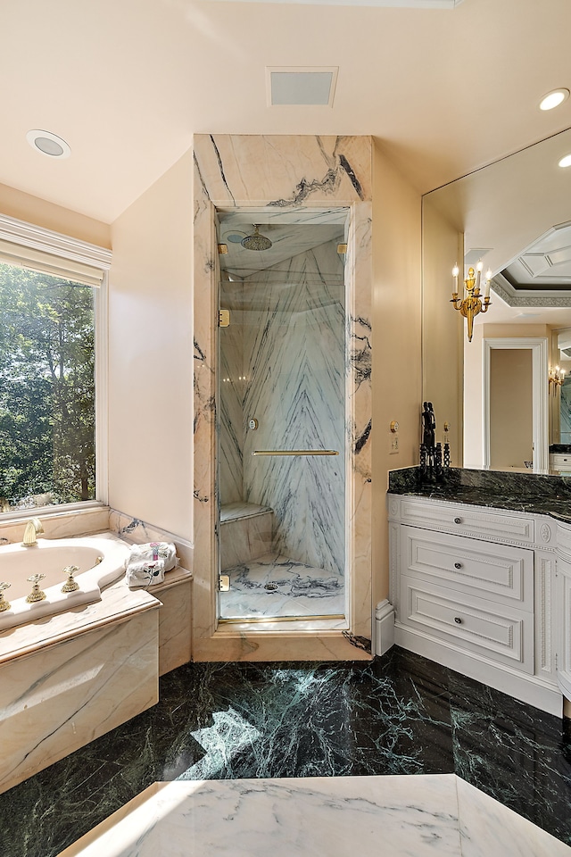 bathroom with shower with separate bathtub, vanity, and a notable chandelier