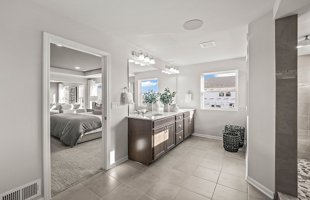 bathroom with tile patterned flooring and vanity