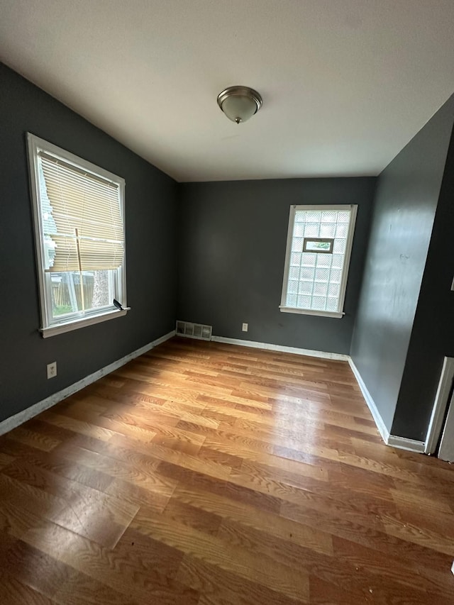 empty room featuring hardwood / wood-style floors