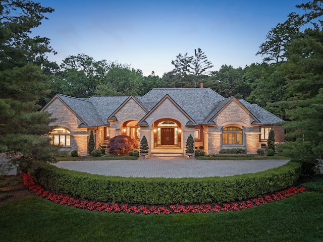 view of front of property with a lawn