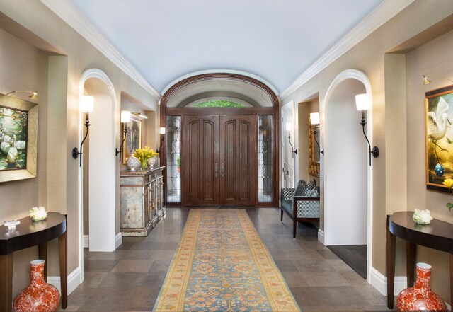 entrance foyer featuring ornamental molding