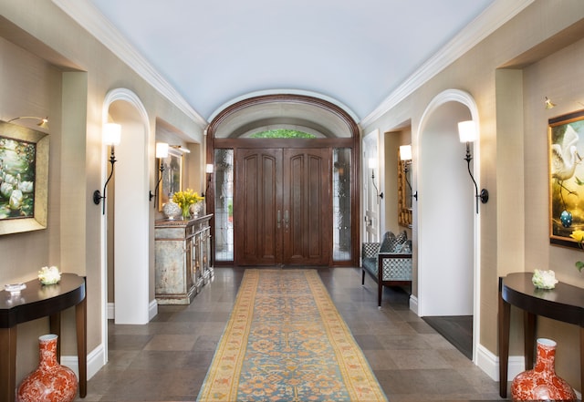 entrance foyer featuring ornamental molding