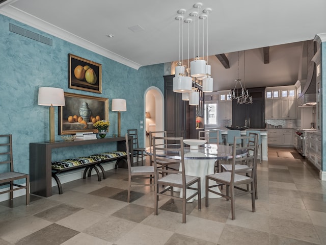 dining space with beam ceiling, a notable chandelier, and crown molding