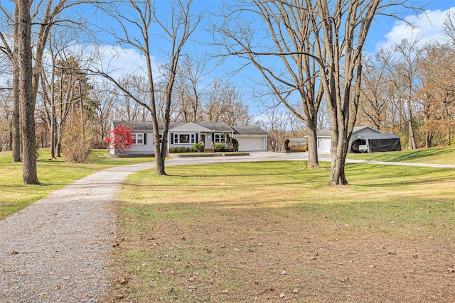 view of front of home featuring a front yard and a garage