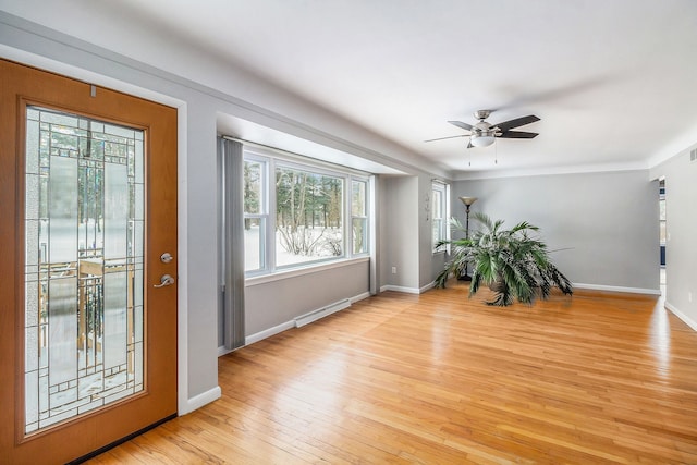 interior space featuring ceiling fan and light wood-type flooring