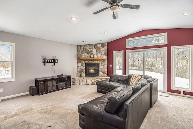 living room featuring light colored carpet, ceiling fan, and a wealth of natural light