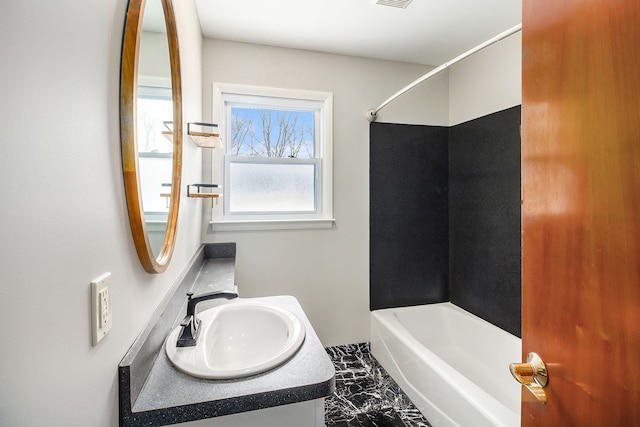 bathroom with bathtub / shower combination and vanity