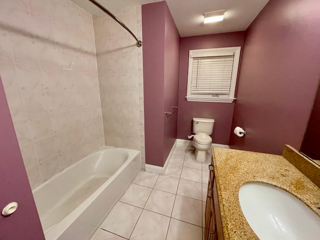 full bathroom featuring tile patterned floors, vanity, toilet, and tiled shower / bath