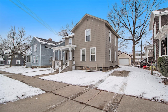 front of property with an outbuilding and a garage