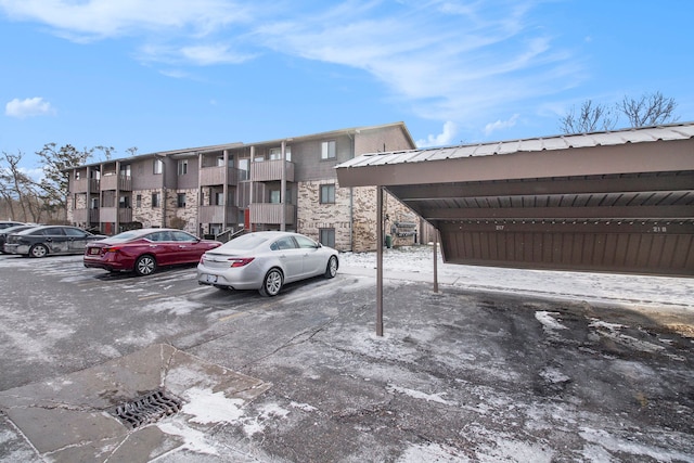 view of vehicle parking featuring a carport