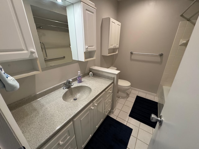 bathroom with vanity, tile patterned flooring, and toilet