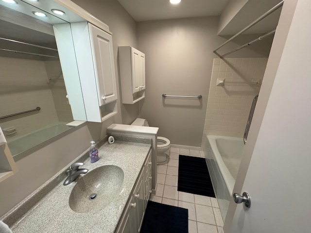 full bathroom with toilet, tile patterned flooring, tiled shower / bath, and vanity