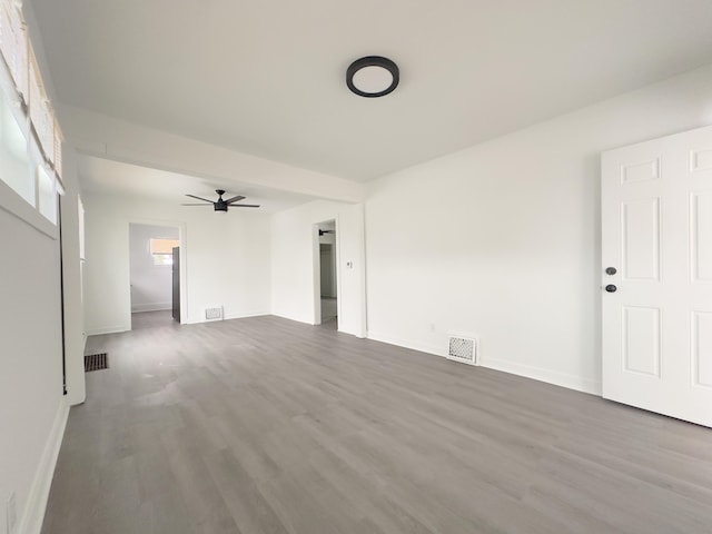 unfurnished living room featuring wood-type flooring and ceiling fan