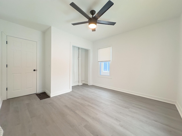 unfurnished bedroom with ceiling fan and light hardwood / wood-style floors