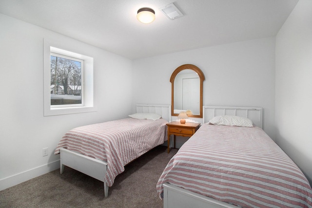 bedroom with dark carpet