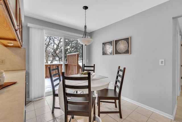 dining space with light tile patterned flooring