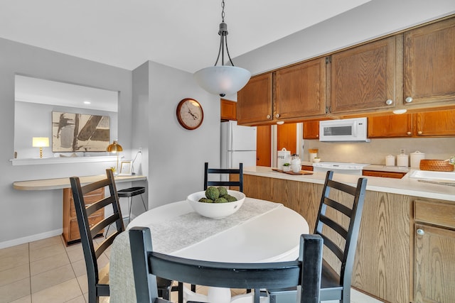 tiled dining space with sink