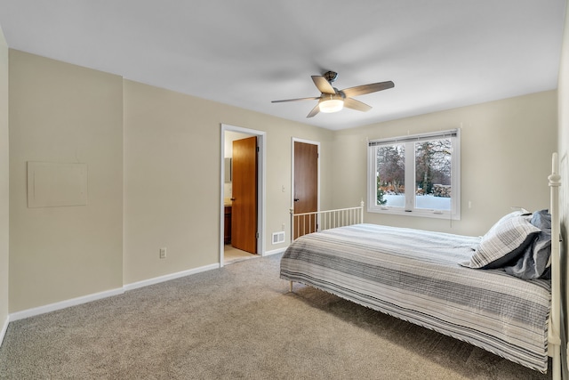 bedroom featuring ensuite bath, ceiling fan, and light carpet