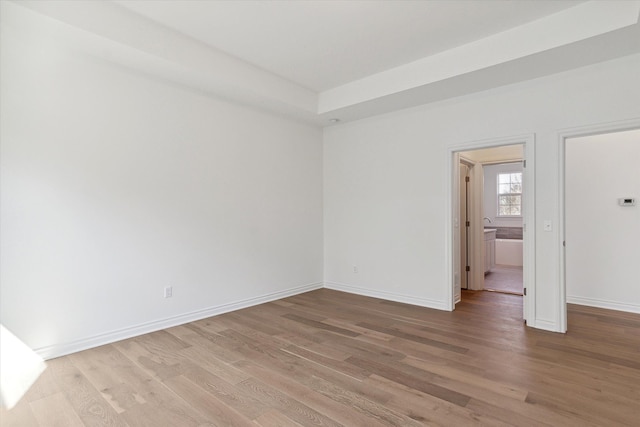 spare room with light hardwood / wood-style floors