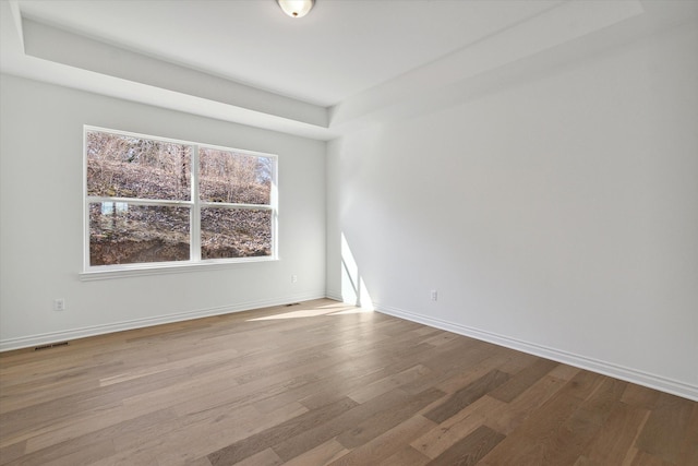 unfurnished room with light hardwood / wood-style floors