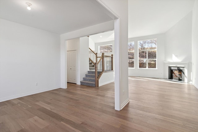 unfurnished living room featuring hardwood / wood-style flooring