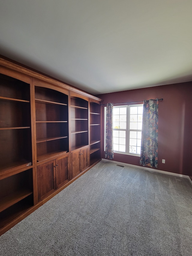 unfurnished living room featuring carpet flooring