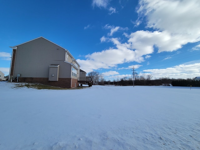 view of yard layered in snow