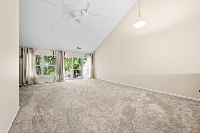 unfurnished living room with ceiling fan, high vaulted ceiling, and carpet flooring