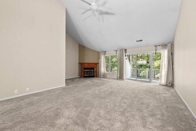 unfurnished living room with lofted ceiling, carpet flooring, and ceiling fan