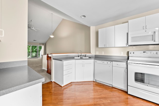 kitchen with white appliances, light hardwood / wood-style floors, white cabinetry, sink, and lofted ceiling