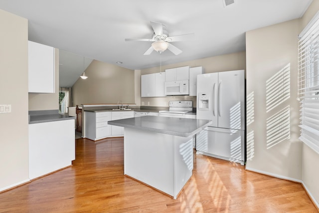 kitchen featuring kitchen peninsula, sink, white cabinetry, white appliances, and light hardwood / wood-style floors