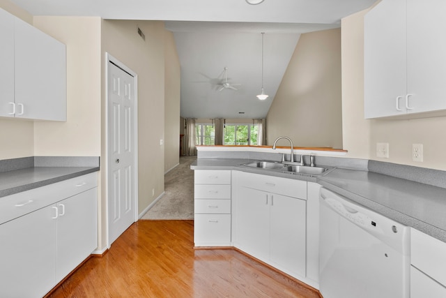 kitchen with sink, white cabinetry, white dishwasher, and lofted ceiling