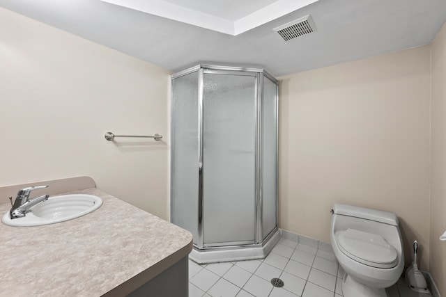 bathroom with an enclosed shower, tile patterned floors, vanity, and toilet