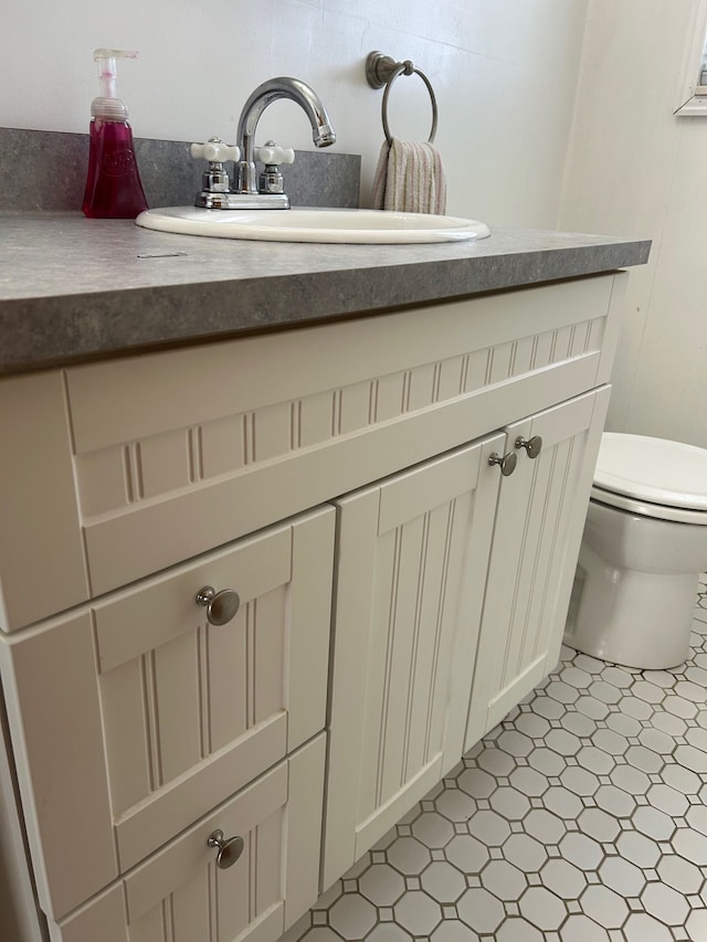 bathroom featuring vanity and toilet