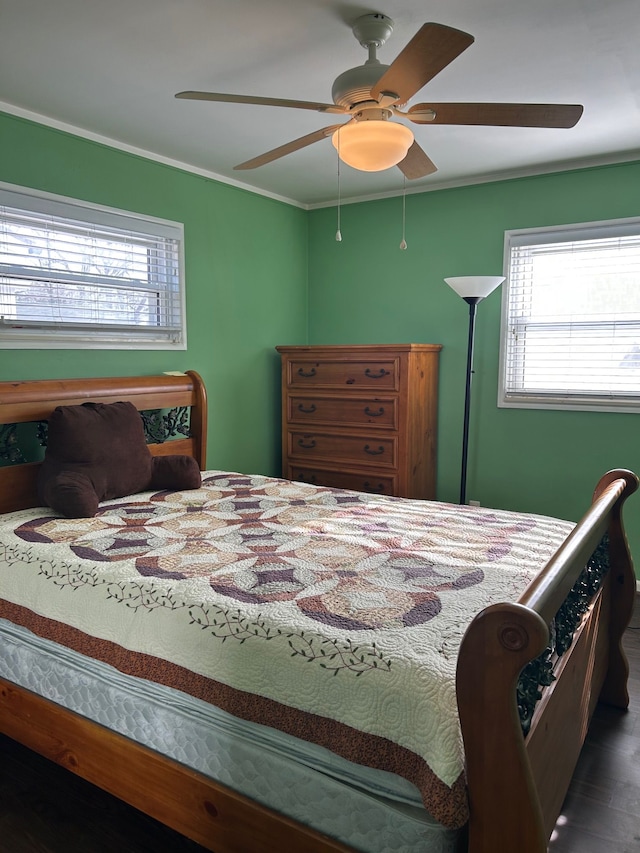 bedroom with crown molding and ceiling fan